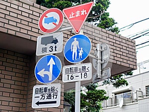 Kyoto,Japan - Nov 13 2016 : Many road signs safety pole at crossroad