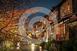 A stream runs past old wooden houses on Shirakawa Dori in the Gion district of Kyoto, Japan