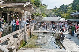 KYOTO, JAPAN - OCTOBER 09, 2015: People Waiting for Water in Kiyomizu-dera Shrine Temple alson know as Pure Water Temple.