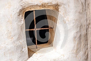 Kythira Ionian islands Greece. Venetian Castle or Fortezza. Window with rusty iron grid background