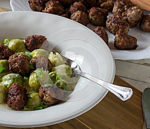 KÃÂ¶ttbullar swedish meatballs with sauce and brussels sprouts photo