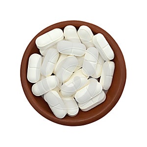 L-lysine tablets in bowl