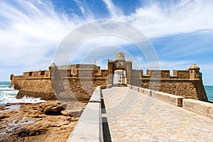 La Caleta Beach, Balneario de la Palma Building and Castle of San Sebastian at sunset - Cadiz, Andalusia, Spain photo