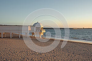 La Caleta Beach and Balneario de la Palma Building at sunset - Cadiz, Andalusia, Spain photo