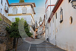 La calle de san Gregorio con tradicionales casas blancas en el b photo