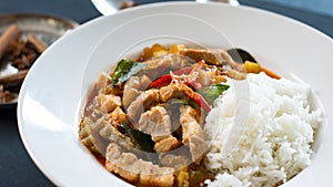 A la carte Red curry with rice, pork belly red curry with bitter cumcumber and coconut milk thai traditional dish.