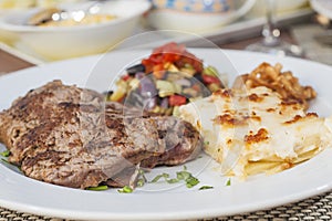 A la carte steak meal on patterned plate photo