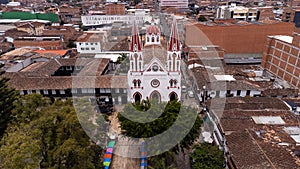 La Ceja, Antioquia - Colombia. March 9, 2024. Minor Basilica of Our Lady of Carmen, located in the main park photo