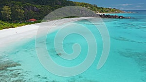 La Digue island, Seychelles. Aerial view of Grand Anse beach, crystal clear turquoise blue ocean bay and white sand