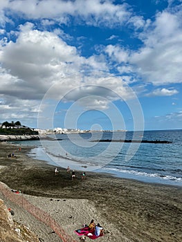 La Enramada Beach on Tenerife, Canary Islands, Spain. People are looking at the ocean photo