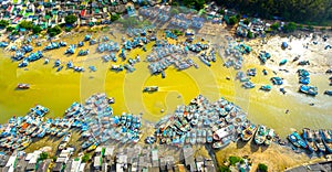 La Gi fishing village seen from above with hundreds of boats anchored along both sides of river