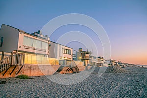 La Jolla, California- Beach houses with glass fence during sunset