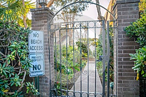 La Jolla, California- Entrance of a private property with signage at the front of the iron gate