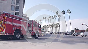 Red firefighters fire truck or engine, emergency lifeguard car, , California USA