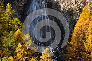 La Pisse waterfall in Autumn in the Queyras Regional Natural Park. Hautes-Alpes, Alps, France