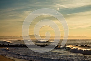 La rhune in wonderful colorful scenery of atlantic ocean with breaking waves in sunset, capbreton, france