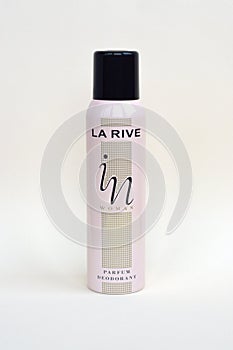 La rive IN woman deodorant bottle on beige background. LA RIVE S.A. is one of the leading producers of perfumes and perfumed