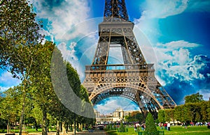 La Tour Eiffel, Paris. Tower sunset view with Champs de Mars gardens