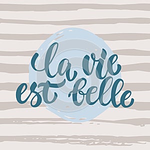 La vie est belle - hand drawn French lettering phrase it means Life is beautiful on striped grunge background