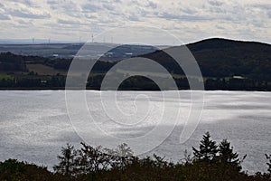 Laacher See in autumn, view towards Mendig and wind power photo