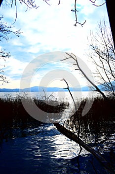 Laacher See (Glees), Germany - 11 30 2020: foggy blue sunset light