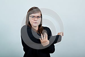 Laady wearing black casual dress and funny glasses standing stretching hands photo