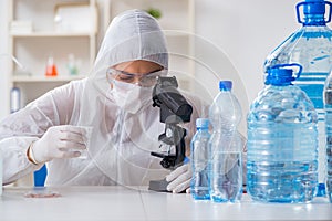 The lab assistant testing water quality