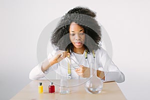 Lab assistant testing water quality. Portrait of a young beautiful African American girl researcher chemistry student
