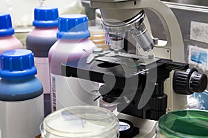 Lab bench with microscopic analysis with samples and reagents