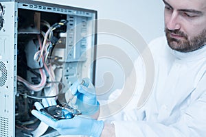 Lab engineer working on broken hard disk