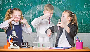 Lab microscope. Student preparing to the exams. Chemistry microscope. Little kids learning chemistry in school lab