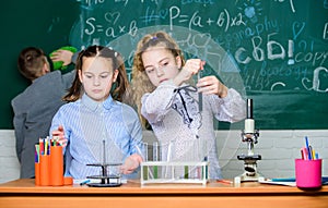 Lab microscope. students doing biology experiments with microscope. Little children at laboratory. Chemistry microscope