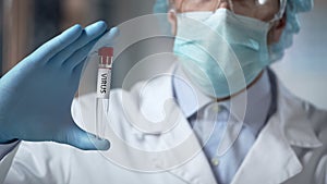 Lab researcher holding virus sample, illegal clinical trials, germ warfare tests