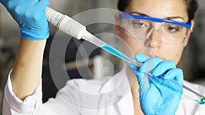 Lab technician analysis xylanase enzyme with pipette
