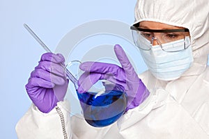 Lab technician with a chemical flask