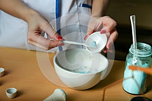 A lab technician conducts chemical experience.