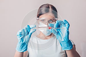 Lab technician holding kit test for PCR testing virus covid19. Coronavirus COVID-19 swab test kit, PPE protective mask and gloves