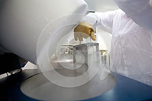 Lab technician with liquid nitrogen container