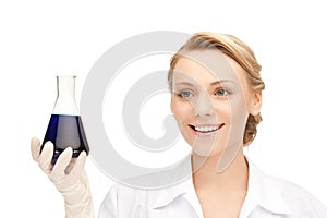 Lab worker holding up test tube