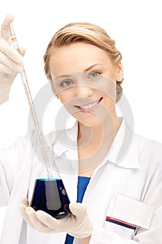 Lab worker holding up test tube