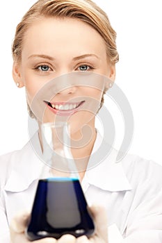 Lab worker holding up test tube