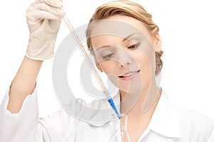 Lab worker holding up test tube