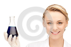 Lab worker holding up test tube