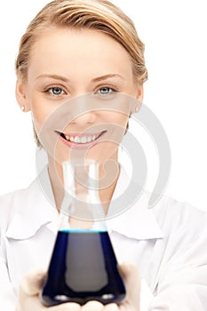 Lab worker holding up test tube