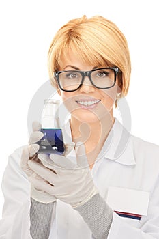 Lab worker holding up test tube