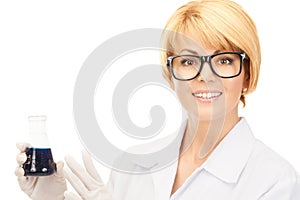 Lab worker holding up test tube