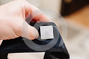 label on black compression underwear after mammoplasty. photo
