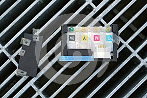 A label of a color tank inkjet printer throw away on a grille of a drain pipe, environments concept