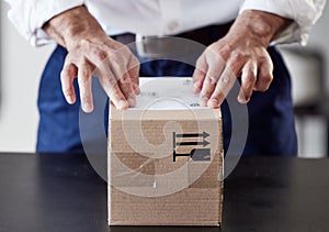 Label, delivery or hands of businessman with box for ecommerce, courier cargo or distribution service. Shipping, order