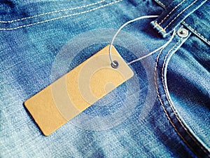 Label price tag mockup on blue jeans.